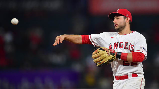 Sep 26, 2023; Anaheim, California, USA; Los Angeles Angels second baseman David Fletcher (22) throws to first for the out against Texas Rangers shortstop Josh Smith (47) during the seventh inning at Angel Stadium.